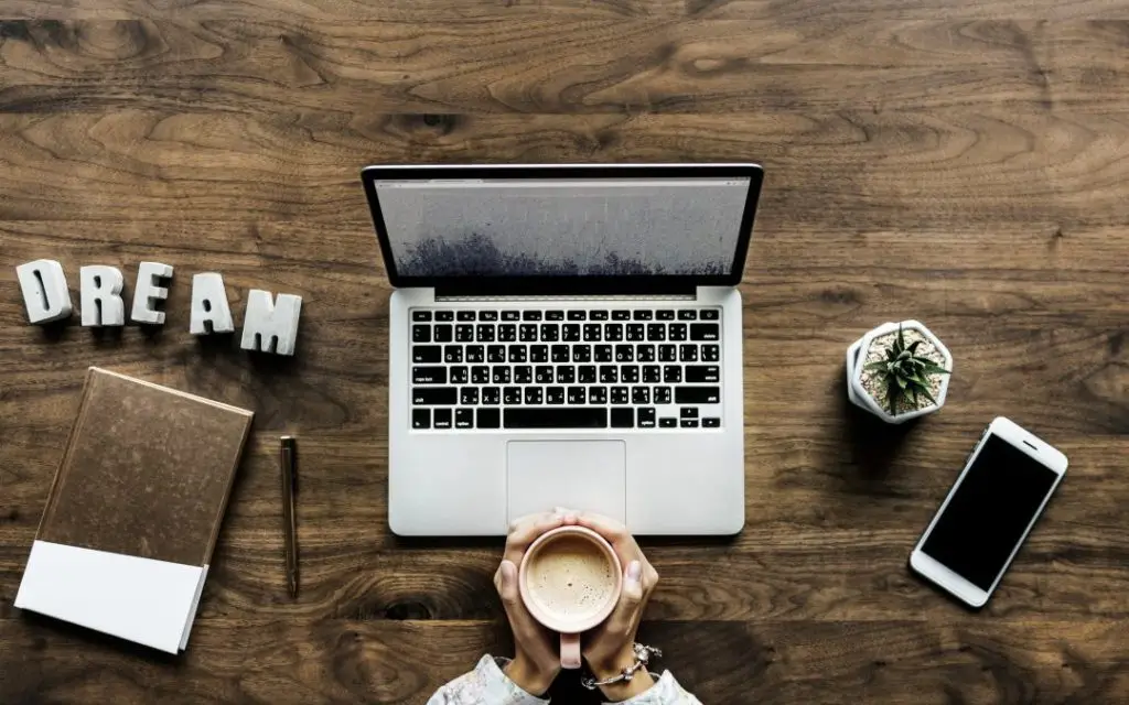 Cup of coffee and a laptop computer