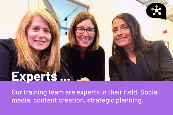 Lisa and two of the Social Medicine team at a workshop looking at the camera.